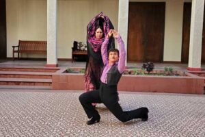 Female dancer and @albertossye in flamenco style positions.